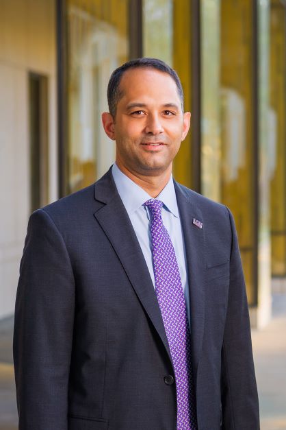 Dean Jared Llorens in the BEC courtyard.