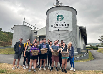 Gorup of people in front of Starbucks factory in Costa Rica