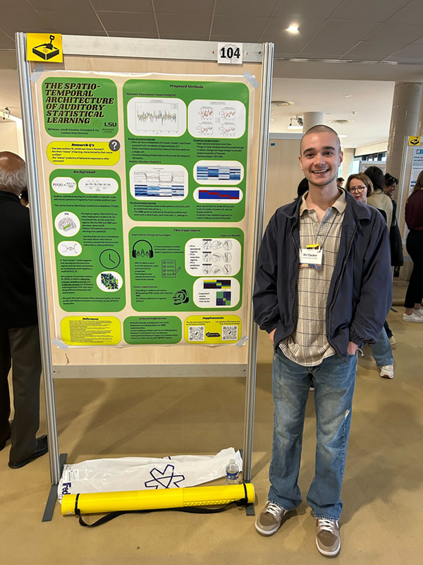 Student presenting a research poster