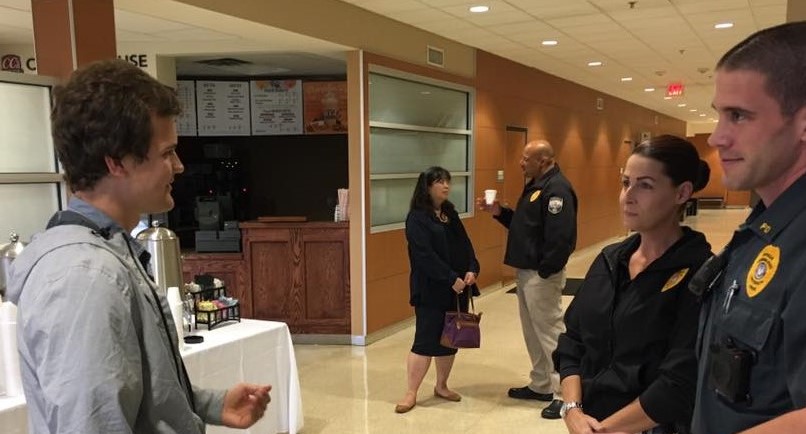 officers talking with student