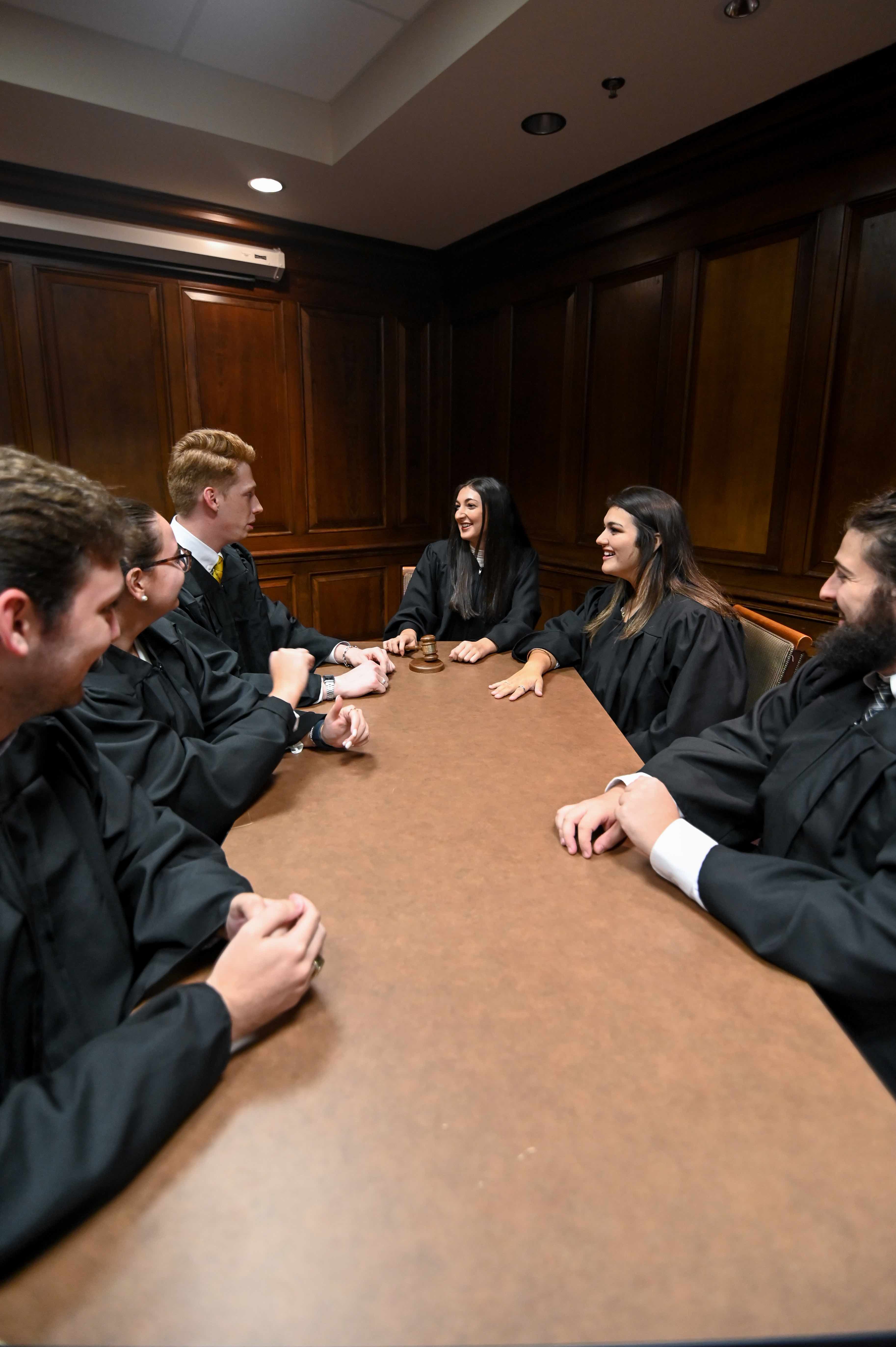 justices sit at table