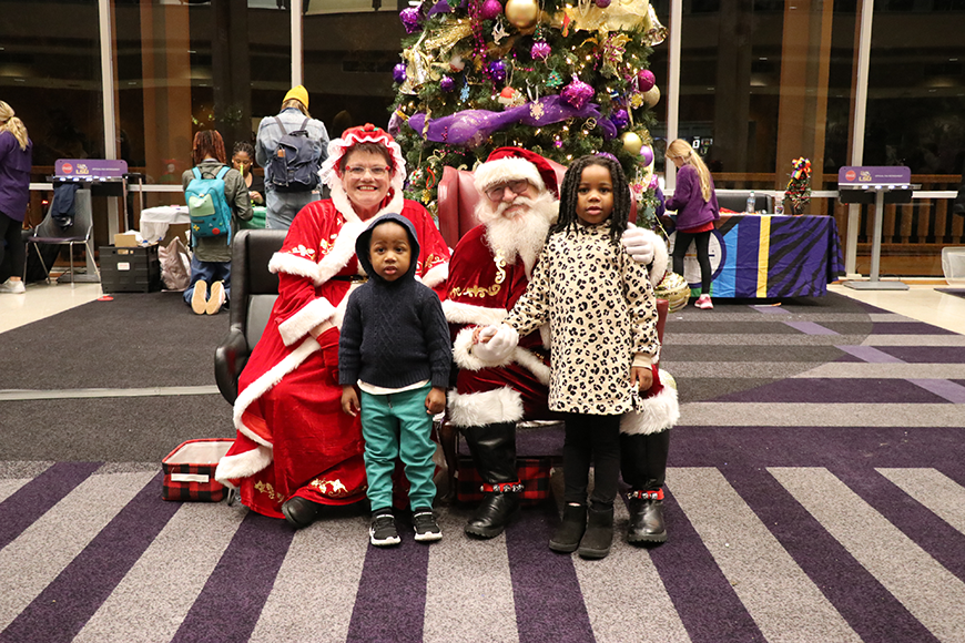 children with Santa and Mrs. Claus