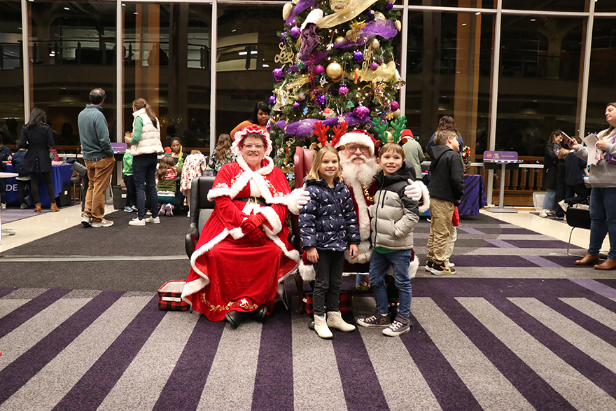family with Santa and Mrs. Claus